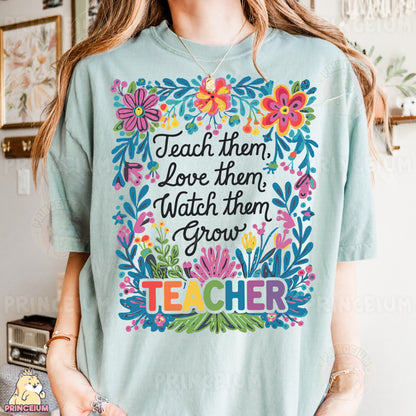 a woman wearing a t - shirt that says teach them, love them, watch