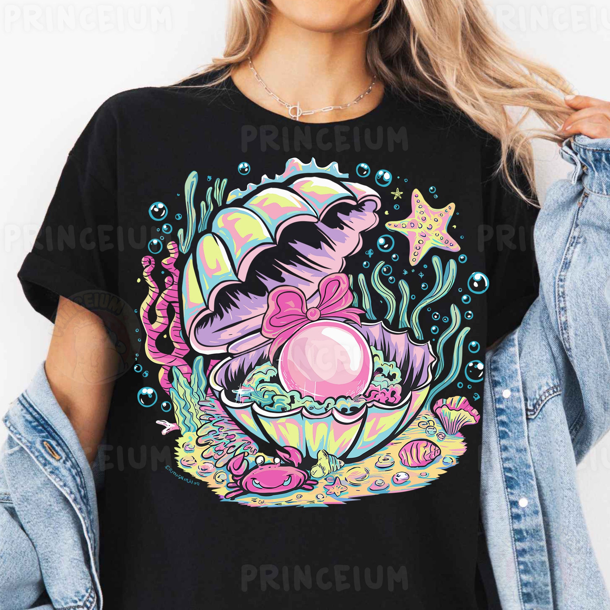 a woman wearing a black shirt with an image of a mermaid on it