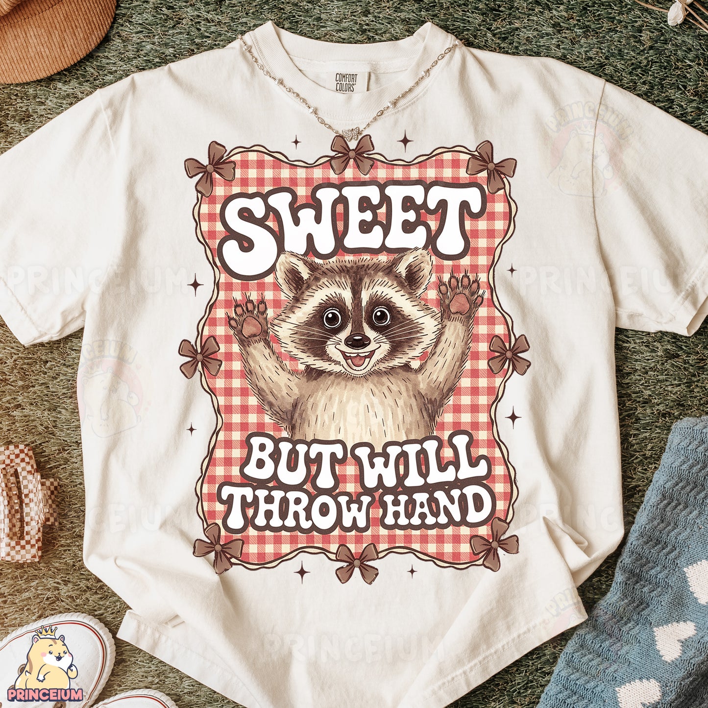 a t - shirt with a raccoon saying sweet but will throw hand