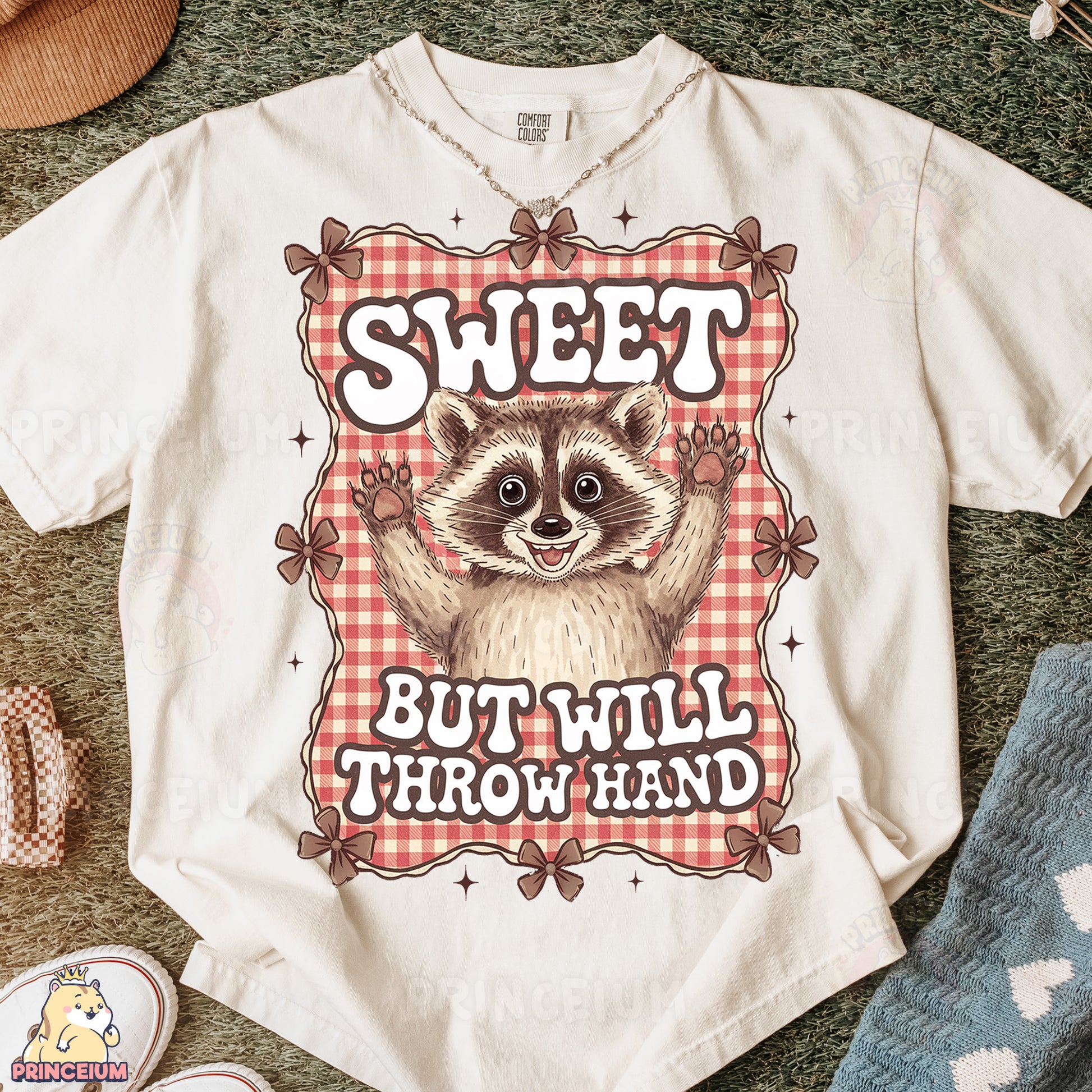 a t - shirt with a raccoon saying sweet but will throw hand