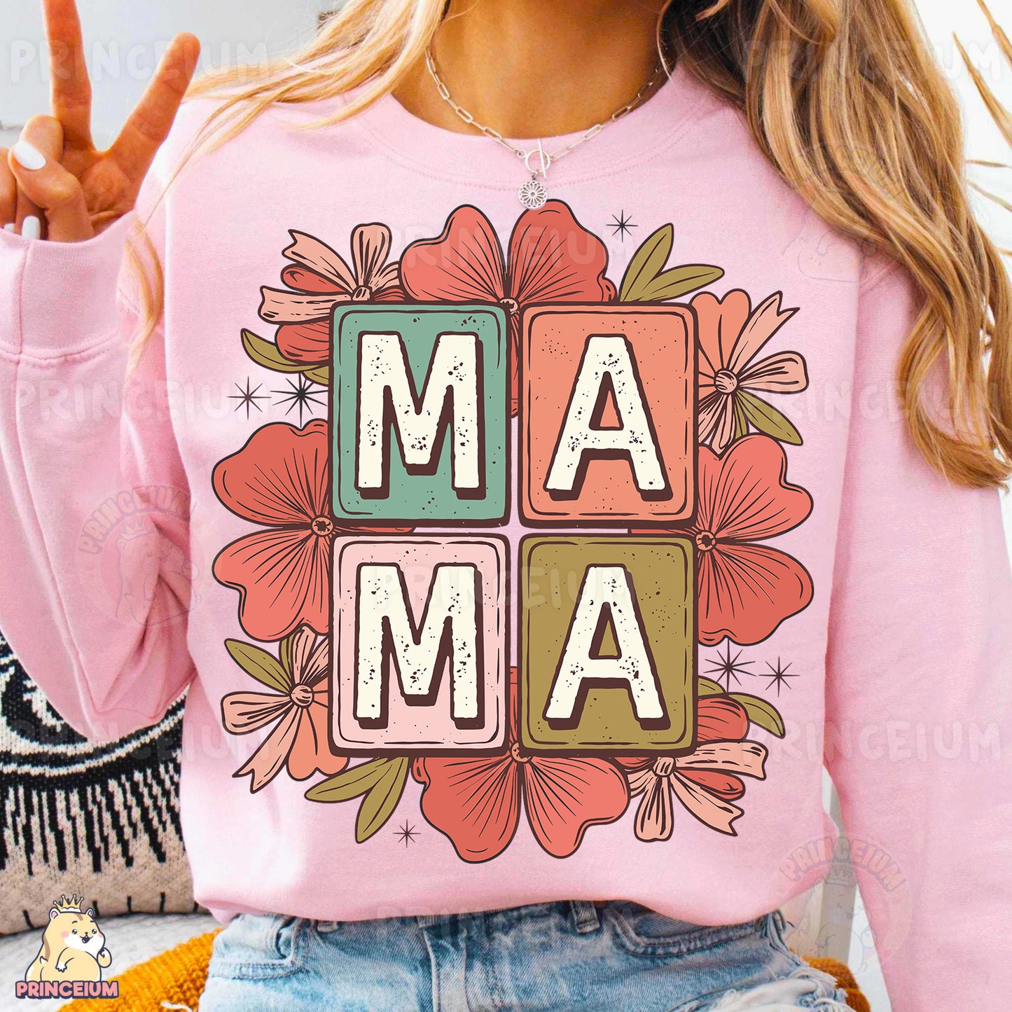 a woman wearing a pink shirt with the word mam on it