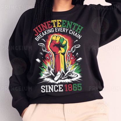 a woman wearing a black sweatshirt with a fist on it