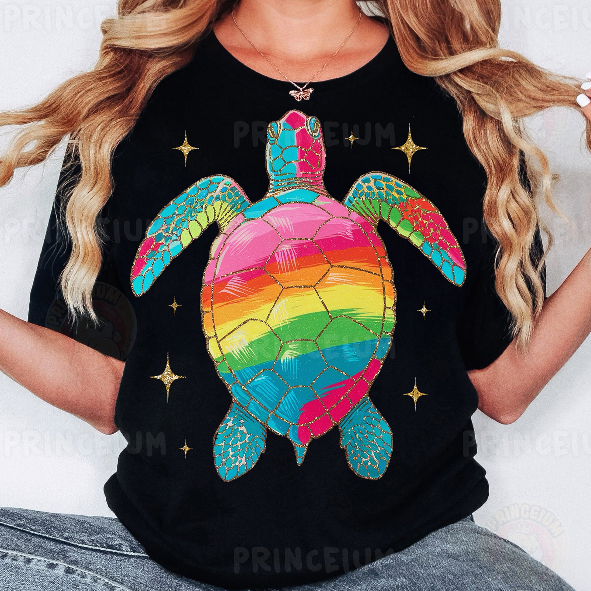 a woman wearing a black shirt with a rainbow turtle on it