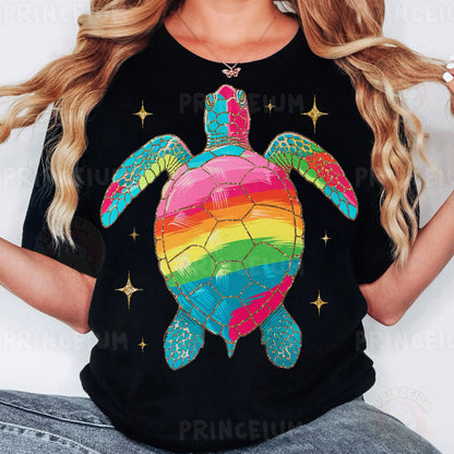 a woman wearing a black shirt with a rainbow turtle on it