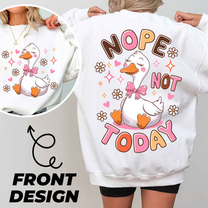 a woman wearing a white sweatshirt with a duck on it