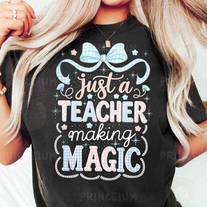 a woman wearing a t - shirt that says just a teacher making magic