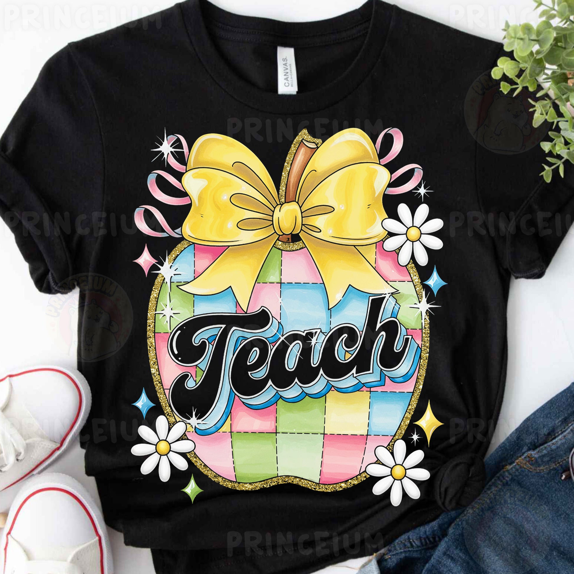 a black shirt with a yellow bow and the word teach on it