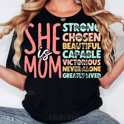 a woman wearing a black shirt that says she is a mom