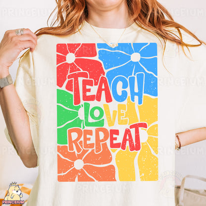 a woman wearing a t - shirt that says teach love repeat