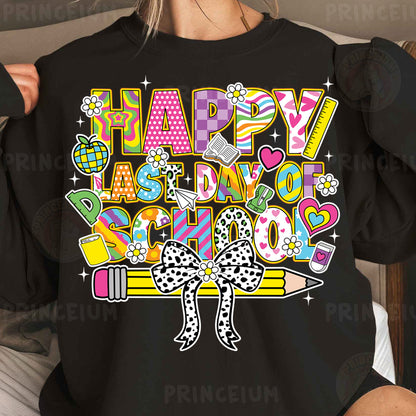a woman wearing a black shirt that says happy last day of school