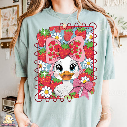 a woman wearing a t - shirt with a picture of a duck wearing a bow