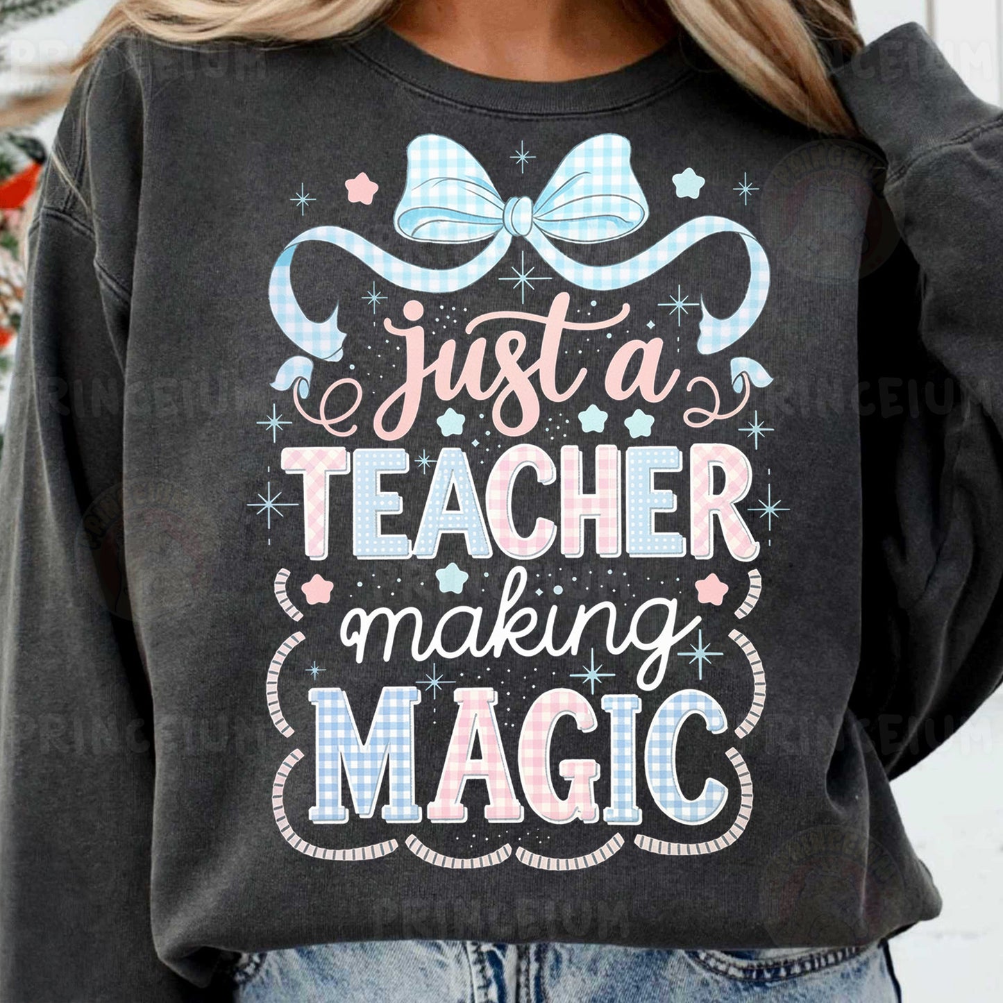 a woman wearing a sweatshirt that says just a teacher making magic