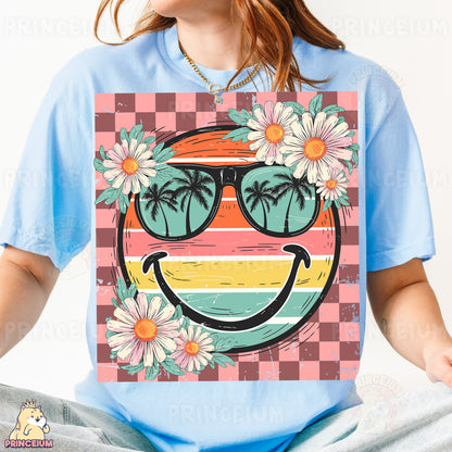 a woman wearing a t - shirt with a picture of a smiley face wearing sunglasses