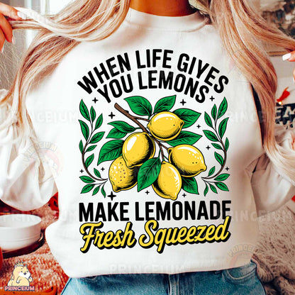 a woman wearing a t - shirt that says when life gives you lemons make