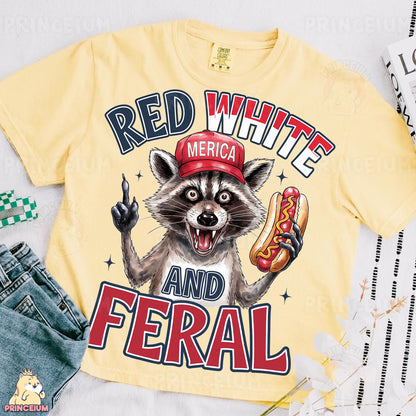 a yellow shirt with a raccoon wearing a red hat and holding a hot