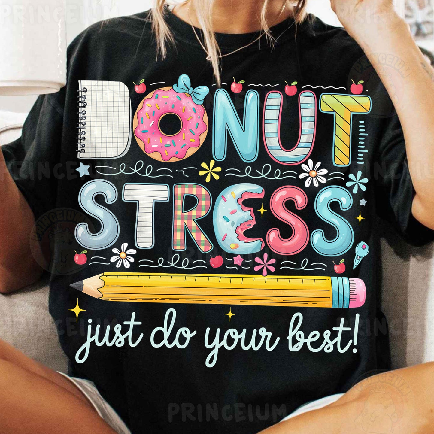 a woman sitting on a couch wearing a donut stress shirt