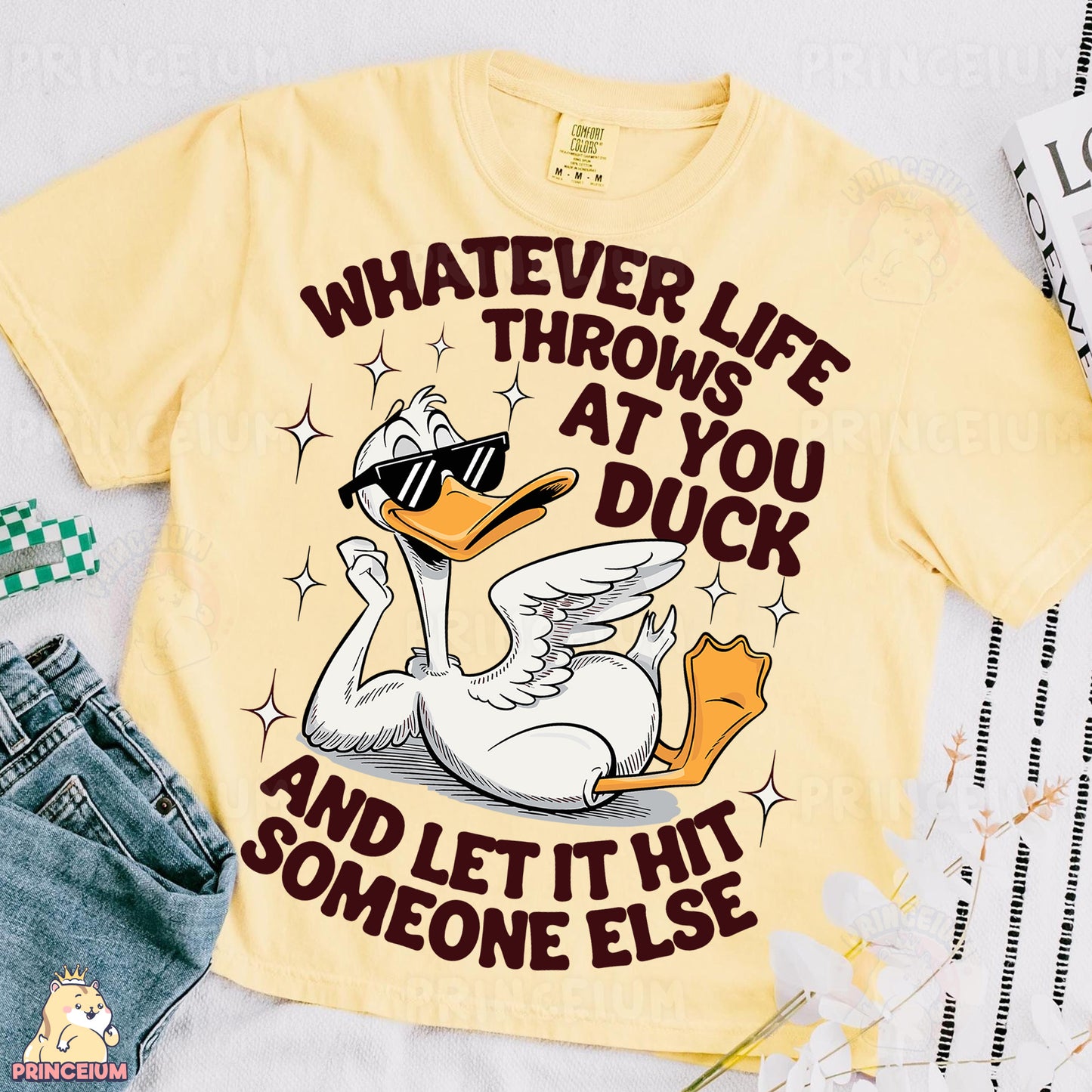 a t - shirt that says whatever life throws at you duck and let it someone