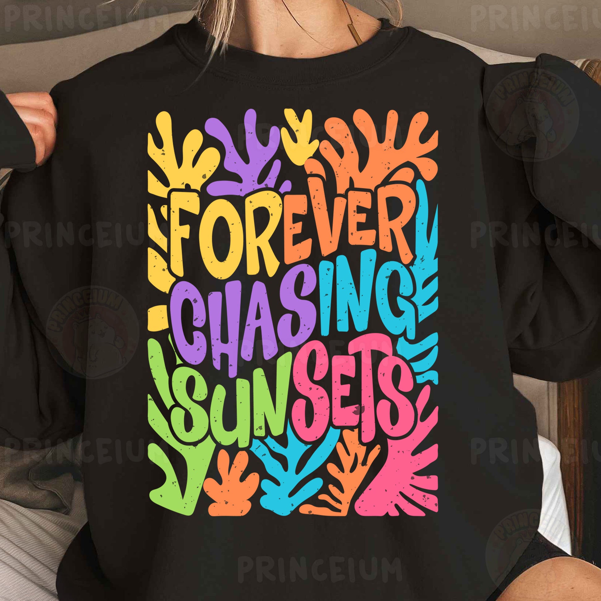 a woman wearing a black sweatshirt that says forever chasing sun sets