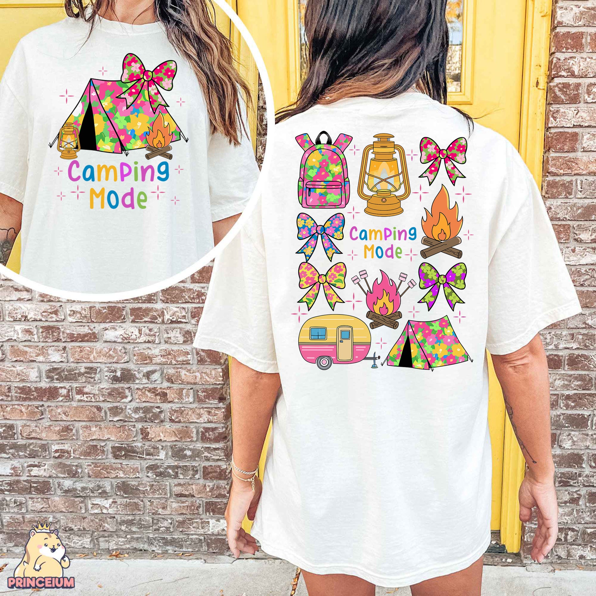 a woman wearing a t - shirt with a camping theme on it