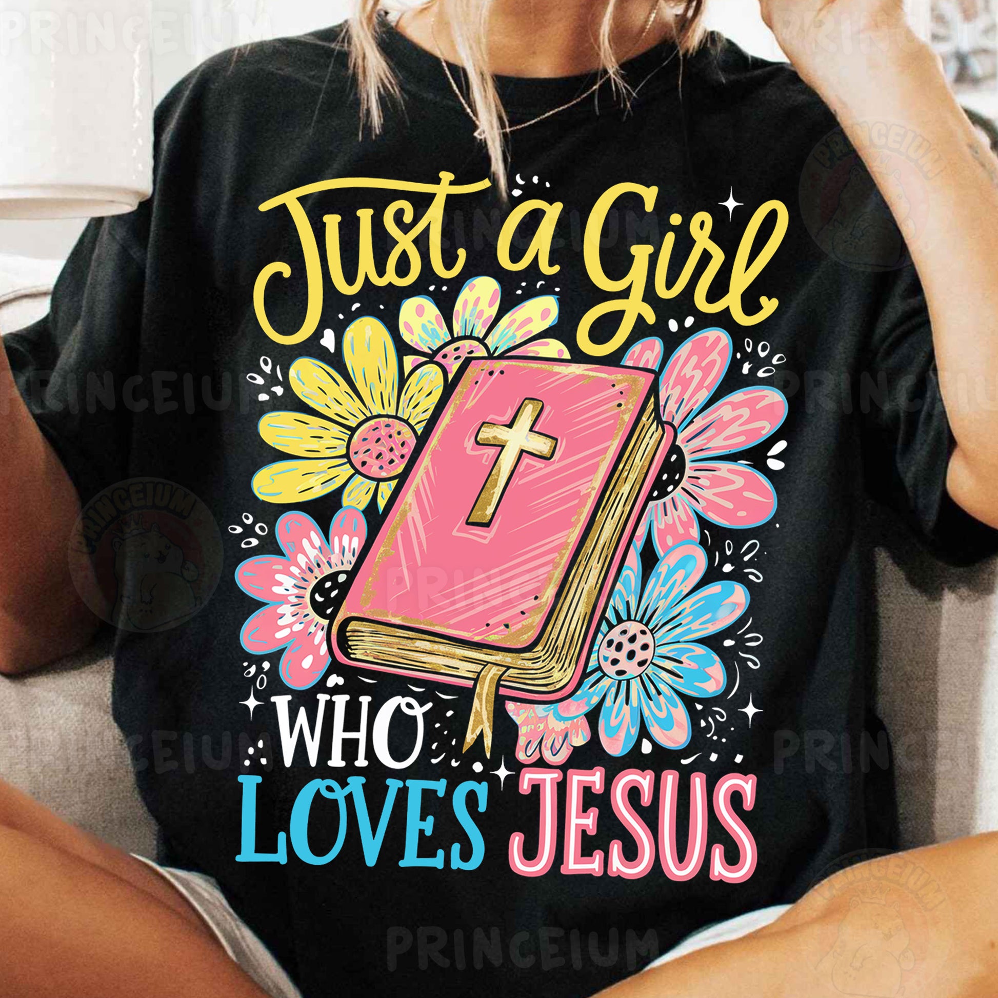 a woman sitting on a couch wearing a t - shirt that says just a girl