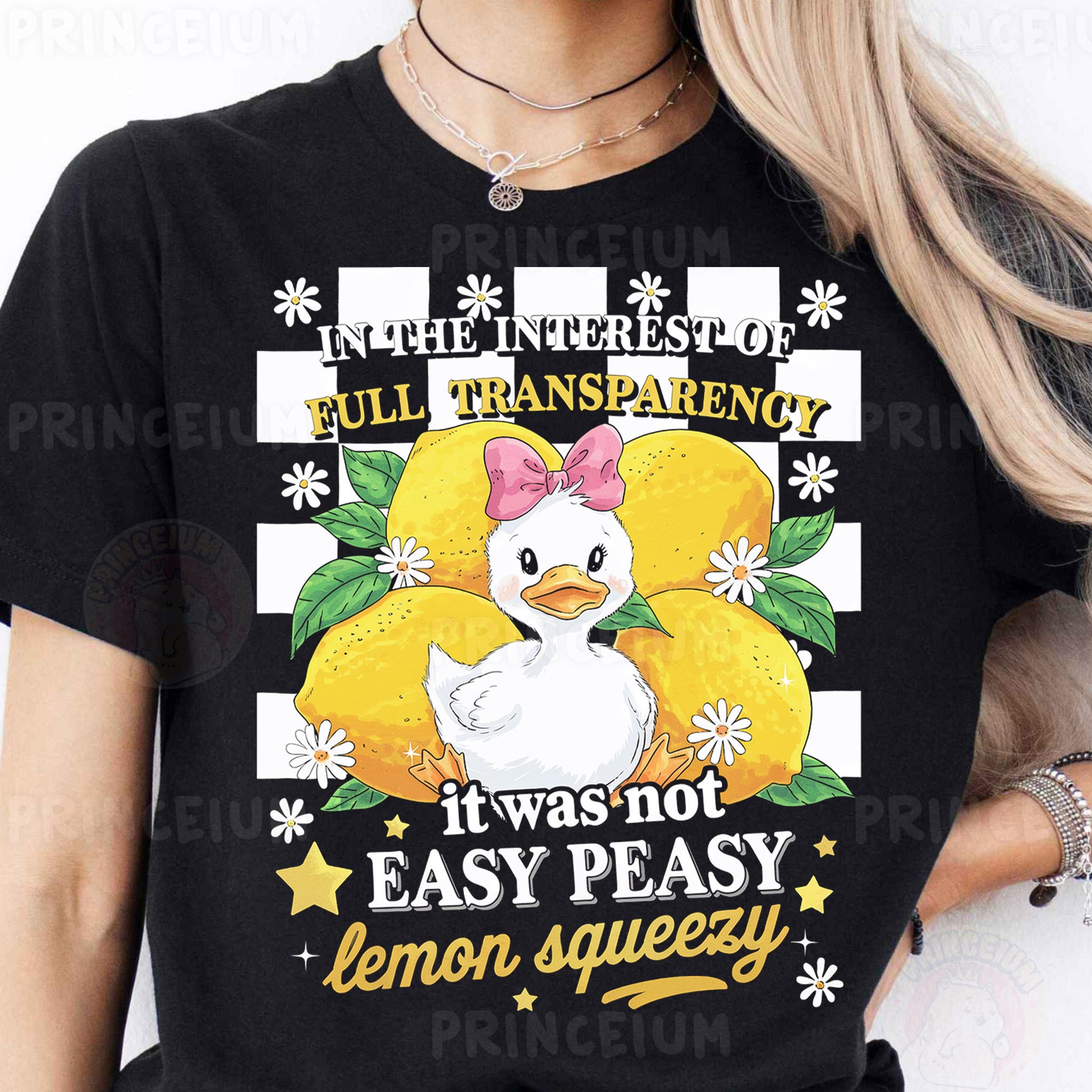 a woman wearing a black t - shirt with an image of a chicken on it