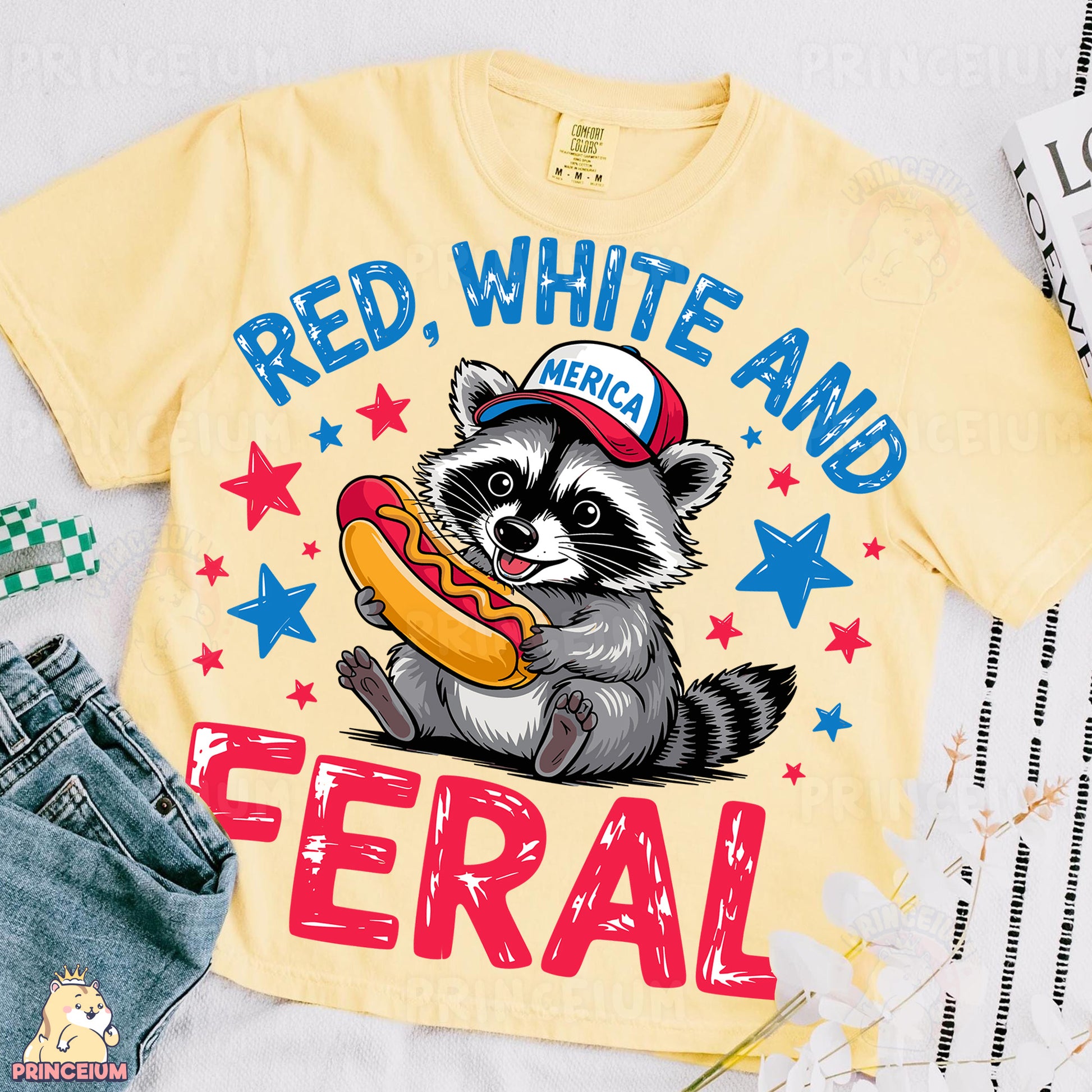 a yellow shirt with a raccoon eating a hot dog