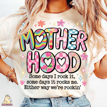 a woman wearing a t - shirt that says mother hood some days i rock it