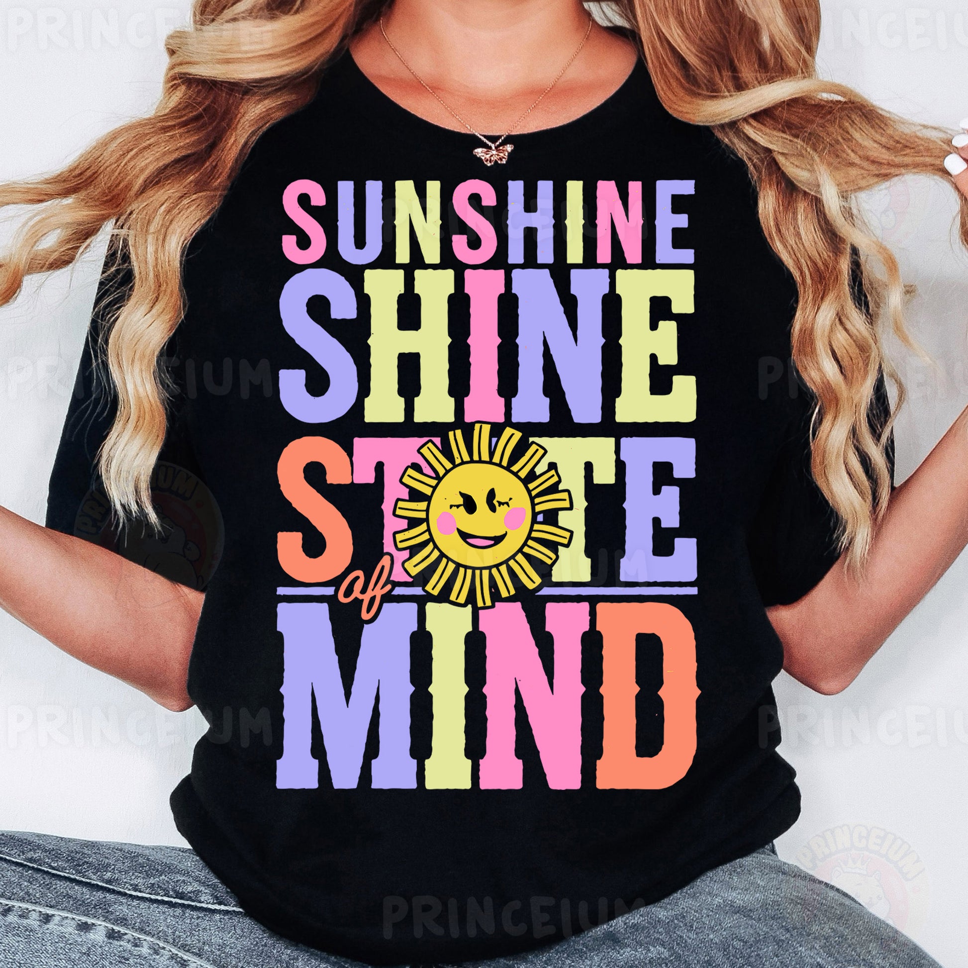 a woman wearing a black shirt that says sunshine shine smile mind