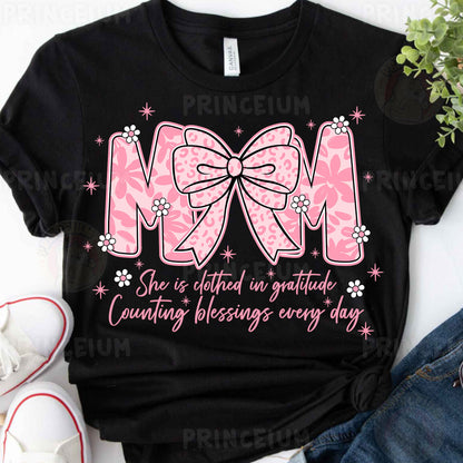 a t - shirt with a pink bow on it