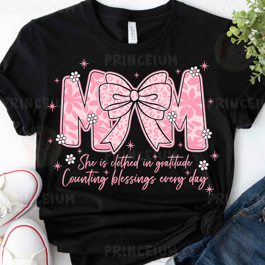 a t - shirt with a pink bow on it