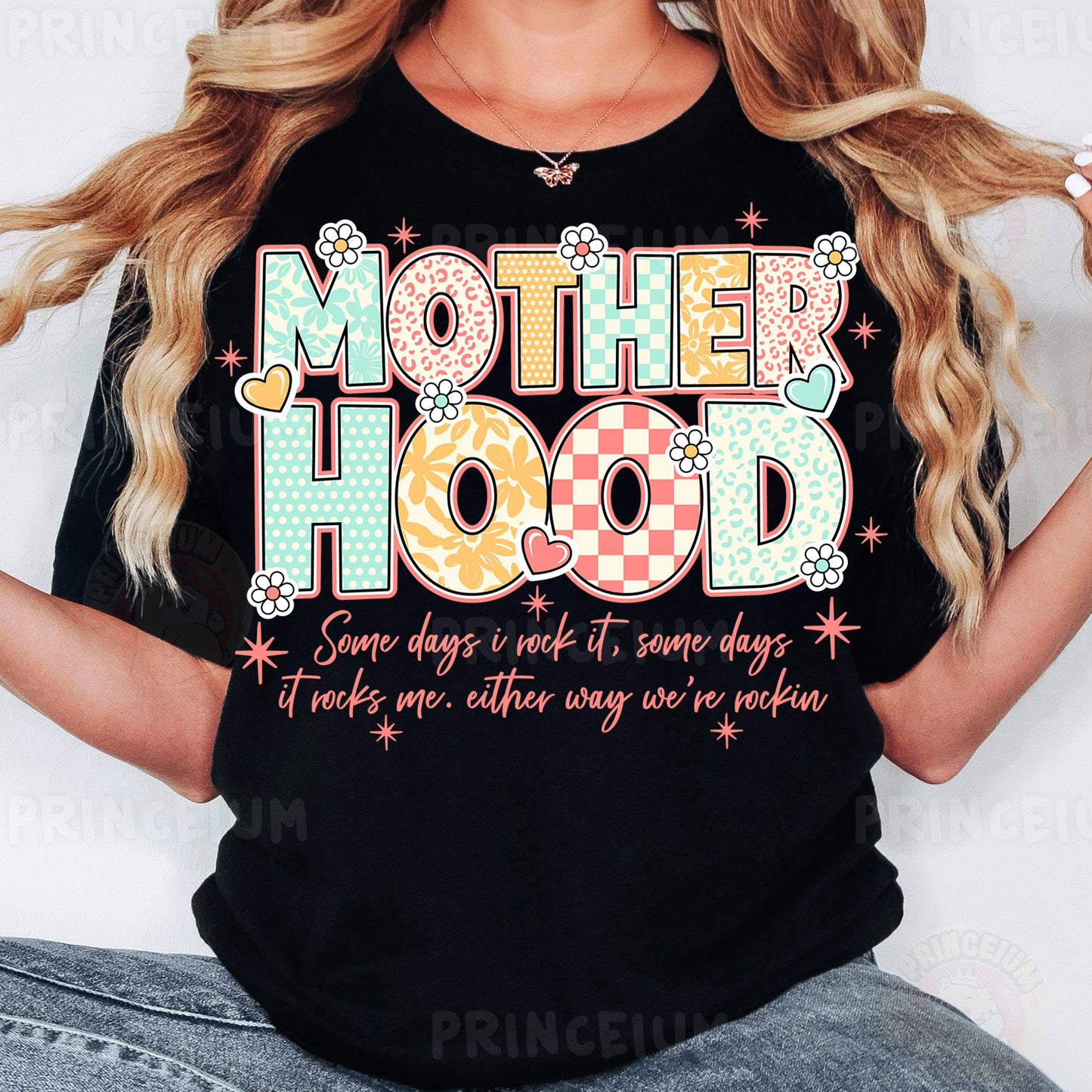 a woman wearing a t - shirt that says motherhood