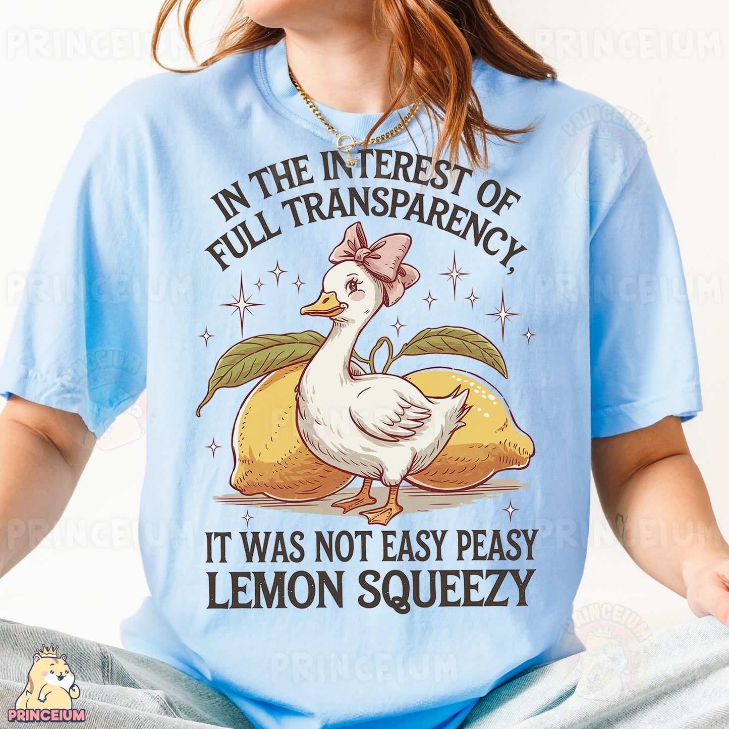 a woman wearing a blue shirt with a chicken on it