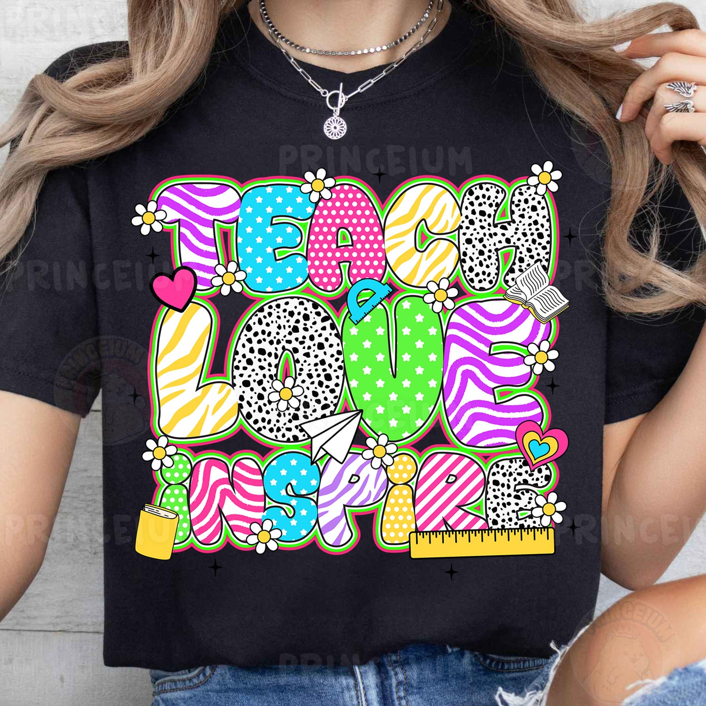 a woman wearing a black t - shirt with the word love spelled in colorful letters