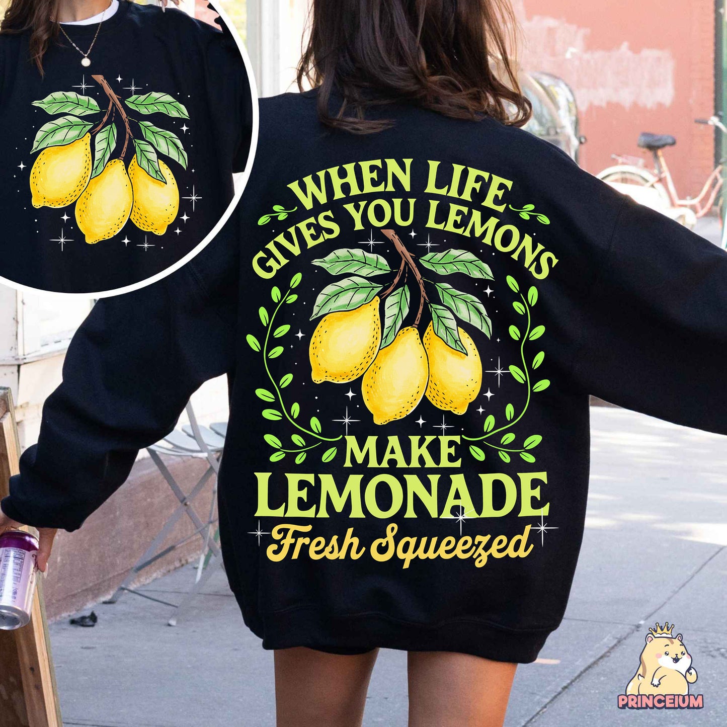a woman wearing a sweatshirt that says when life gives you lemons make lemonade