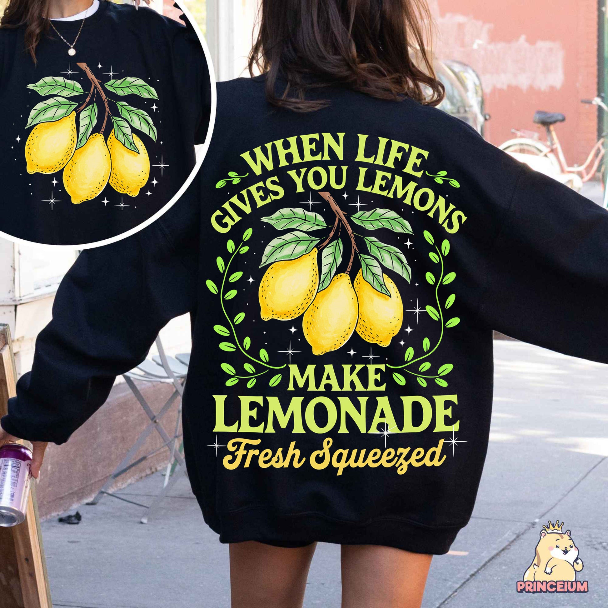 a woman wearing a sweatshirt that says when life gives you lemons make lemonade