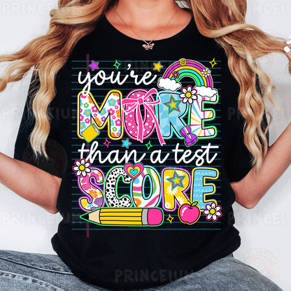 a woman wearing a t - shirt that says you're more than a test