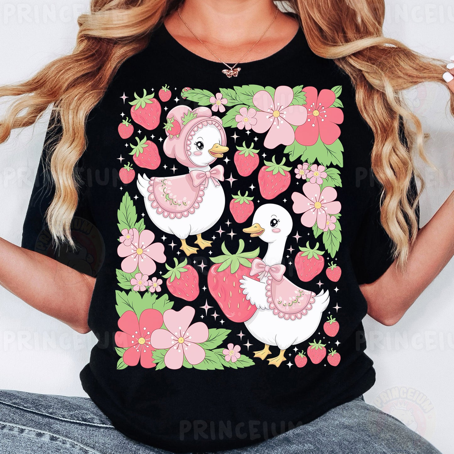a woman wearing a black shirt with pink flowers and two ducks on it