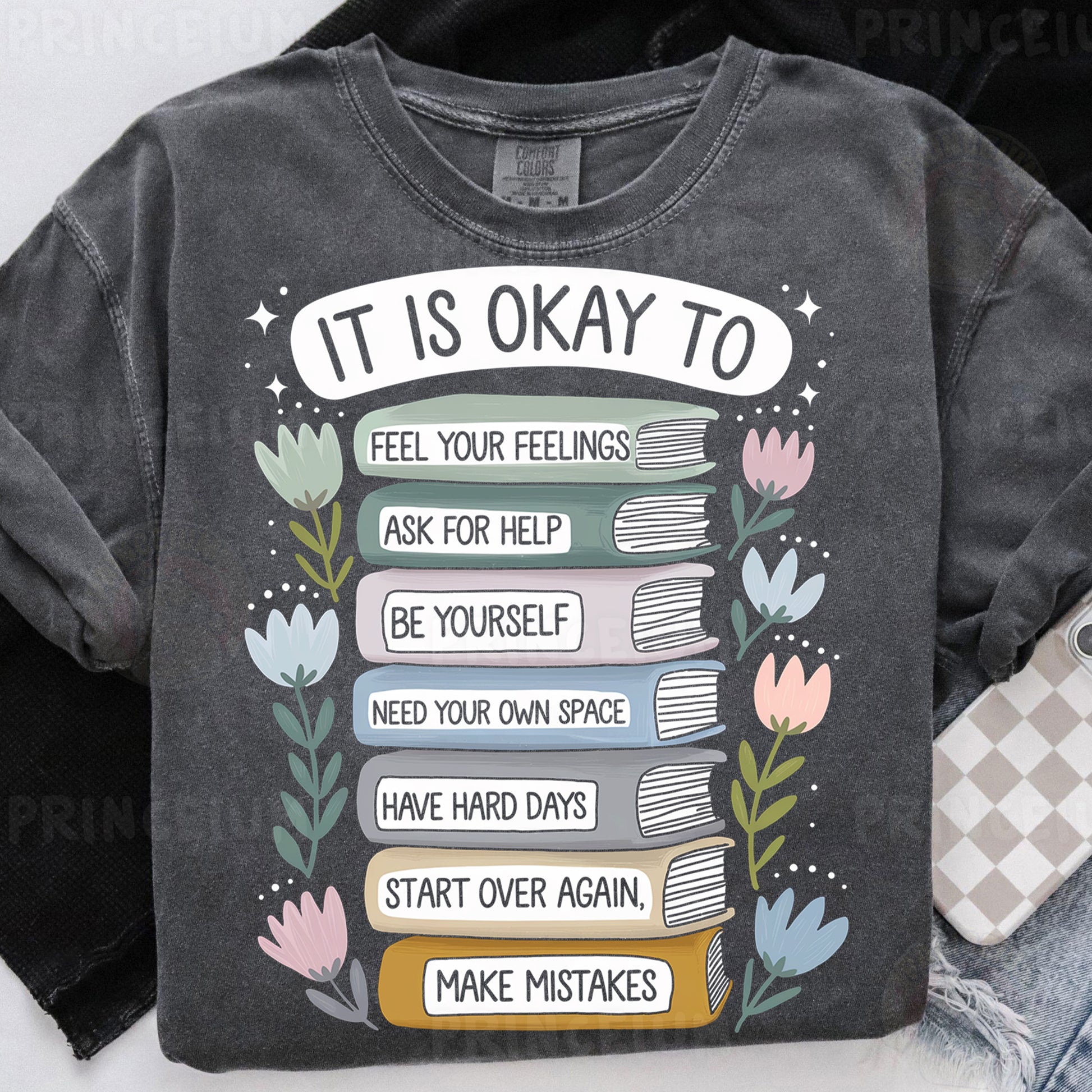 a t - shirt with a stack of books on it