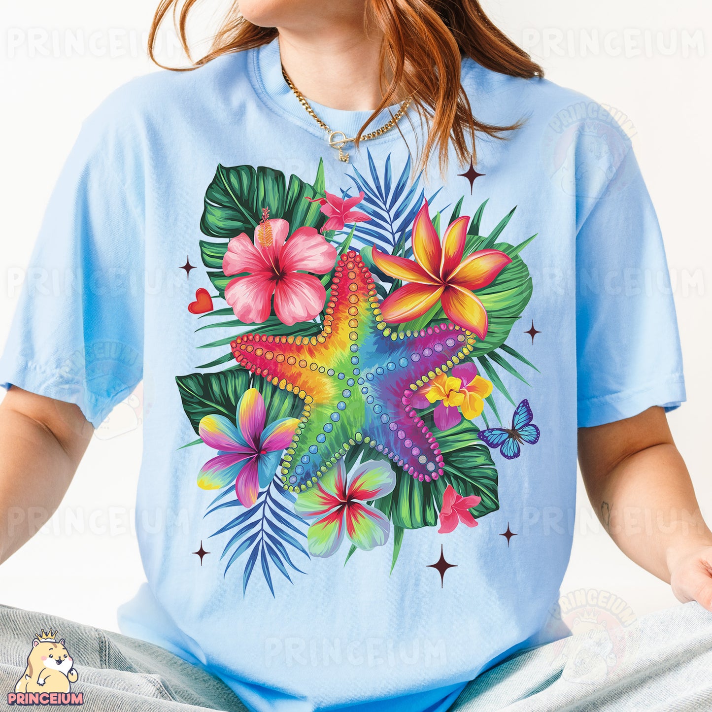 a woman wearing a blue shirt with a starfish and flowers on it