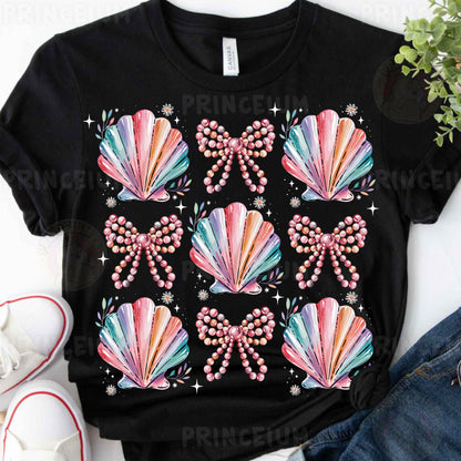 a t - shirt with a bow and pearls on it