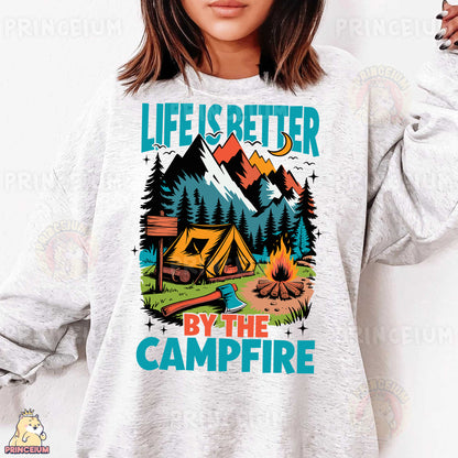 a woman wearing a sweatshirt that says life is better by the campfire