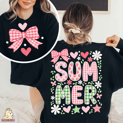 a woman wearing a black shirt with a pink bow on it