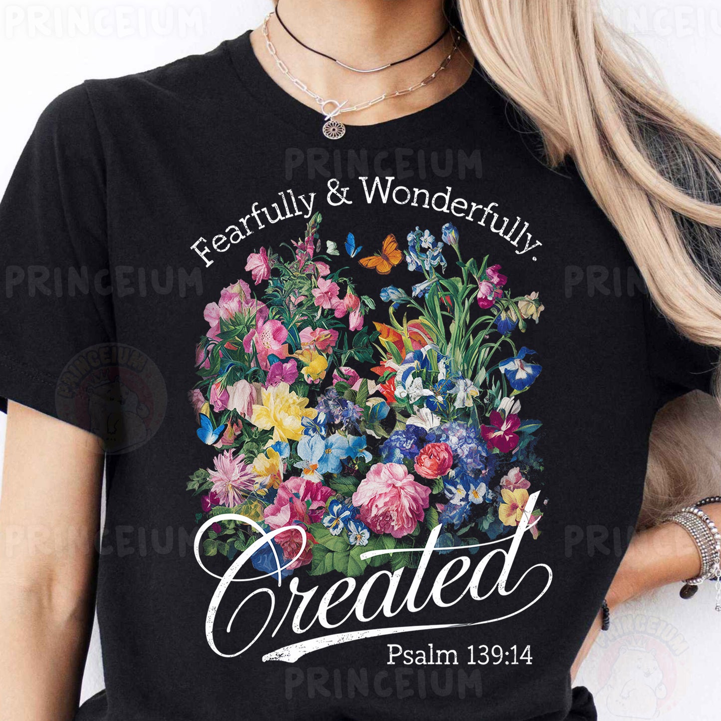 a woman wearing a black t - shirt with a picture of a bouquet of flowers