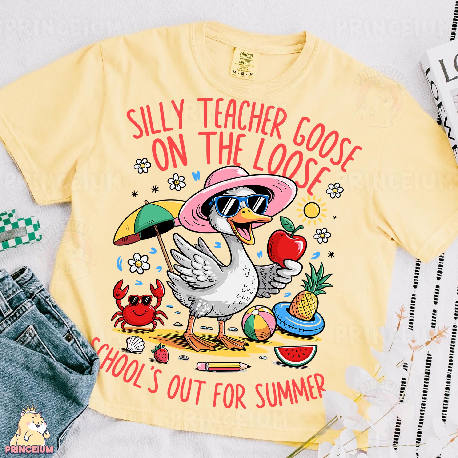 a yellow t - shirt with a picture of a duck wearing a pink hat and