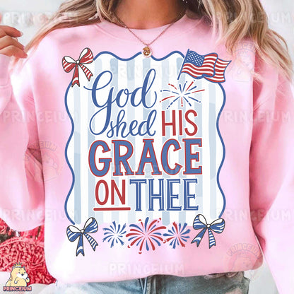 a woman wearing a pink sweatshirt with a patriotic design