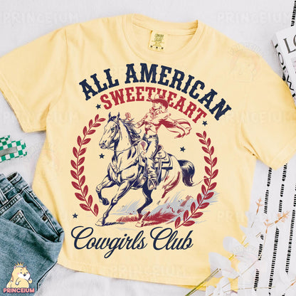 a yellow t - shirt with an image of a cowboy riding a horse