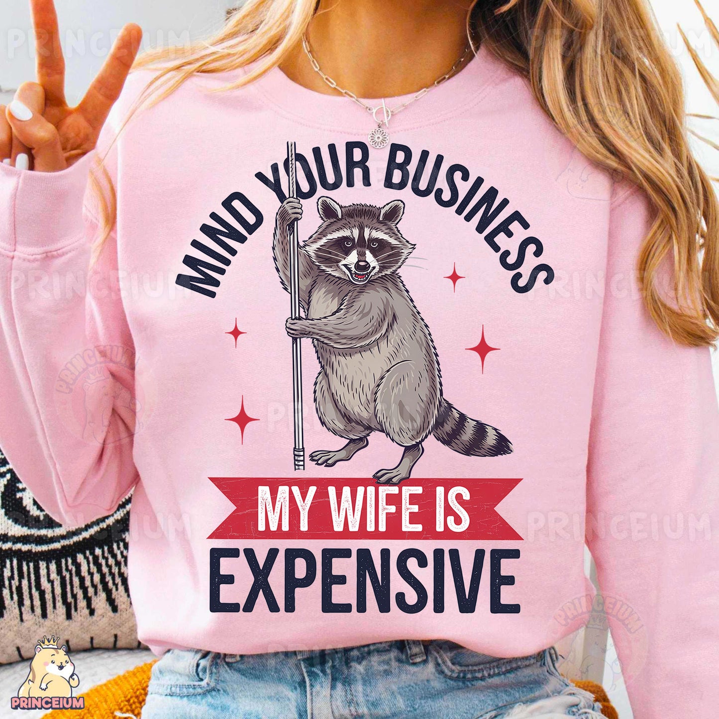 a woman wearing a pink shirt with a raccoon on it