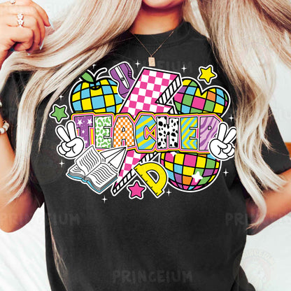 a woman wearing a black t - shirt with colorful designs on it