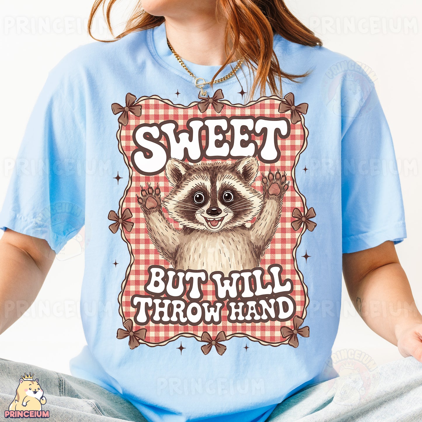 a woman wearing a blue shirt with a raccoon on it