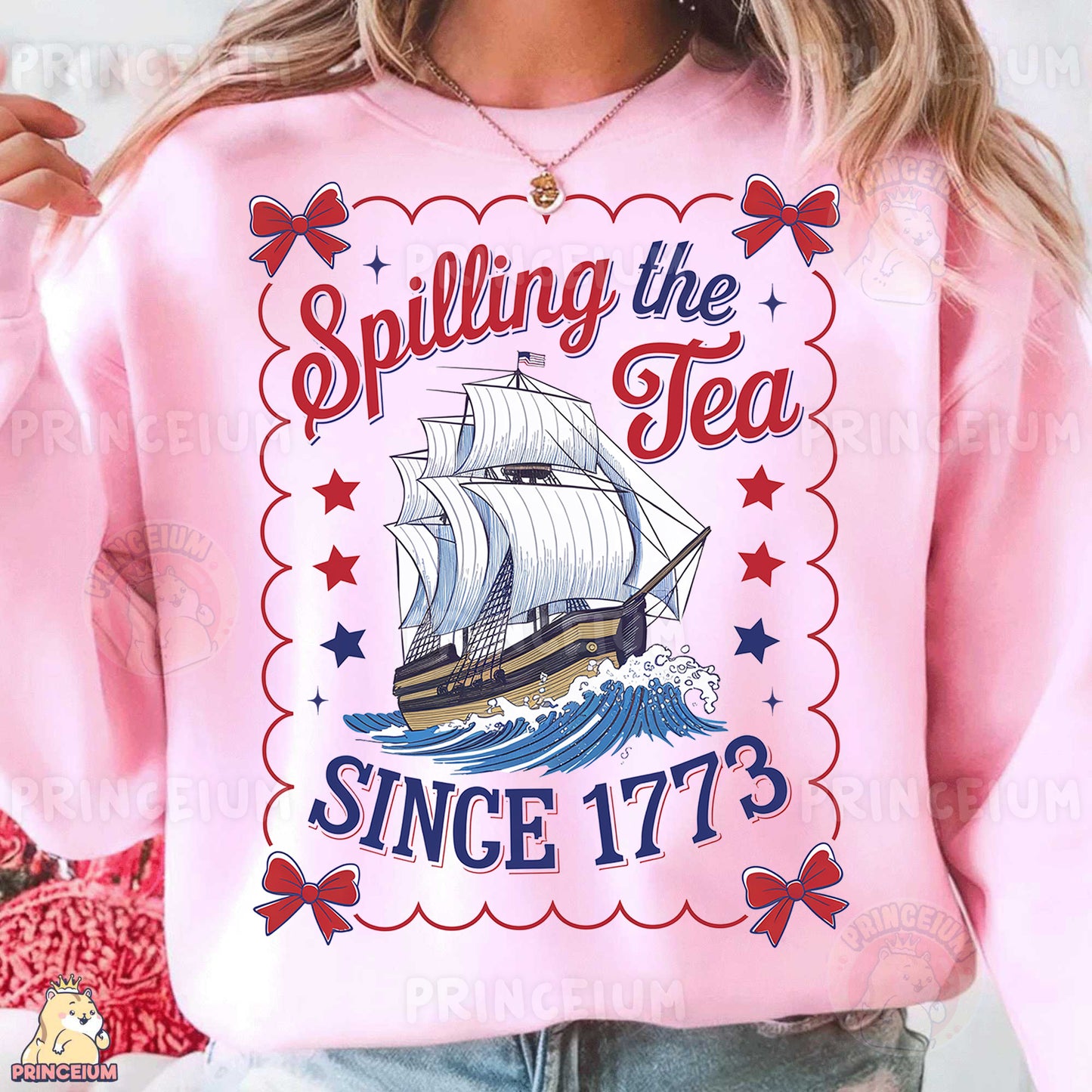 a woman wearing a pink shirt with a ship on it